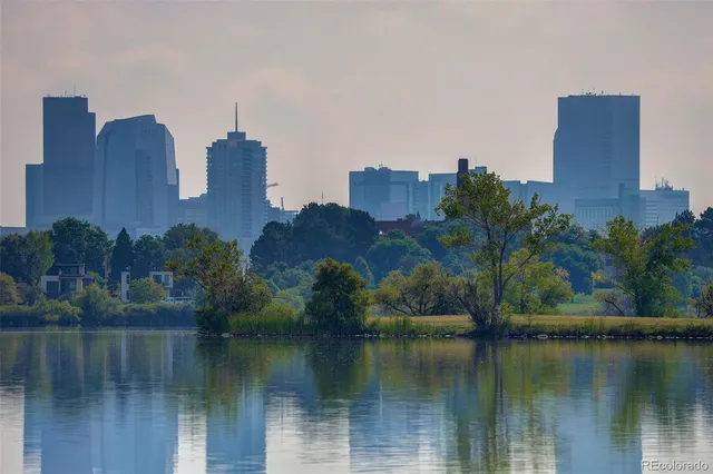 a view of a lake with a house in the background