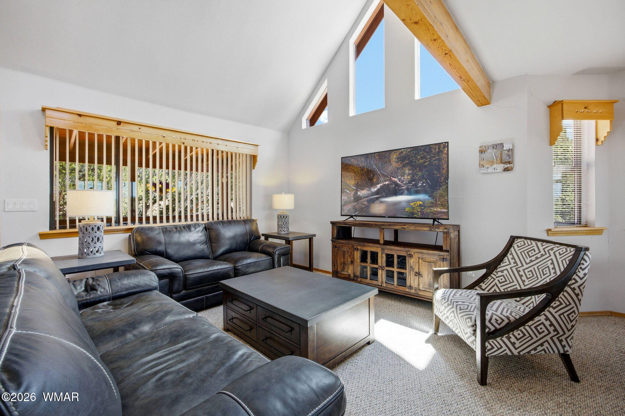 2806 Sky Hawk Drive Overgaard, AZ 85933 - Photo 9 of 43 a living room with furniture and a flat screen tv