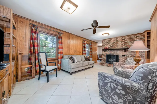 a spacious bathroom with a double vanity sink a toilet and a mirror