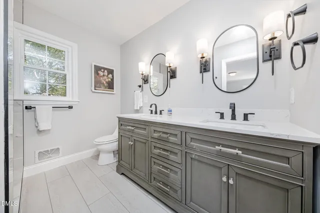 a spacious bedroom with a bed and a large window