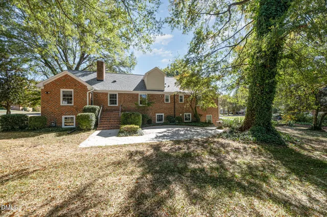 a view of outdoor space with deck and yard