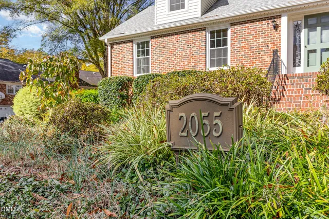 a sign that is on a brick wall