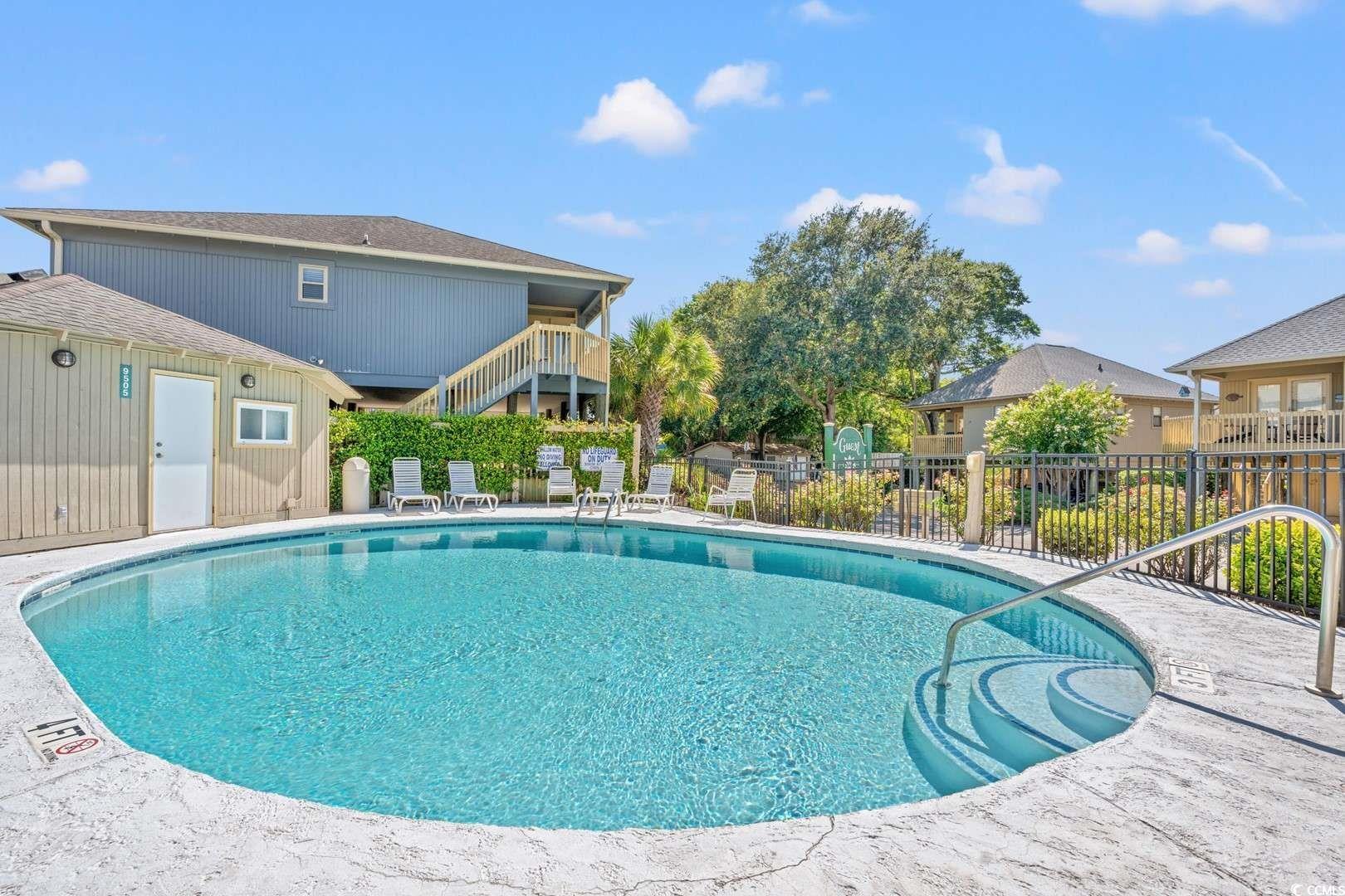 9500 Queens Court Myrtle Beach, SC 29572 - Photo 25 of 33 Pool with a patio area and fence