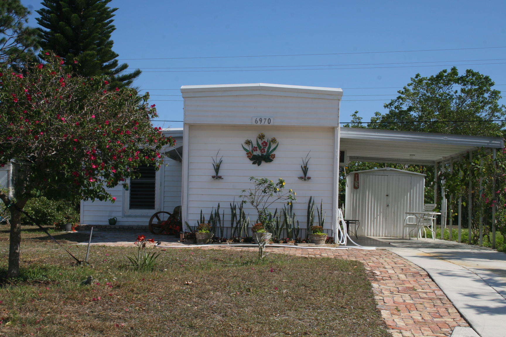 6970 Southeast Ridgeway Terrace Hobe Sound, FL 33455 - Photo 1 of 24 exterior front
