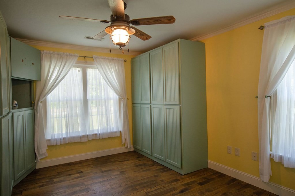 767 Lane Hollow Road Sevierville, TN 37876 - Photo 19 of 31 a view of empty room with wooden floor and fan