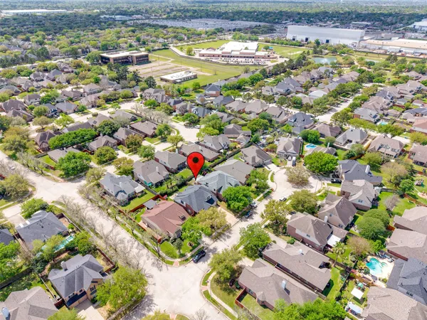 an aerial view of residential houses with outdoor space