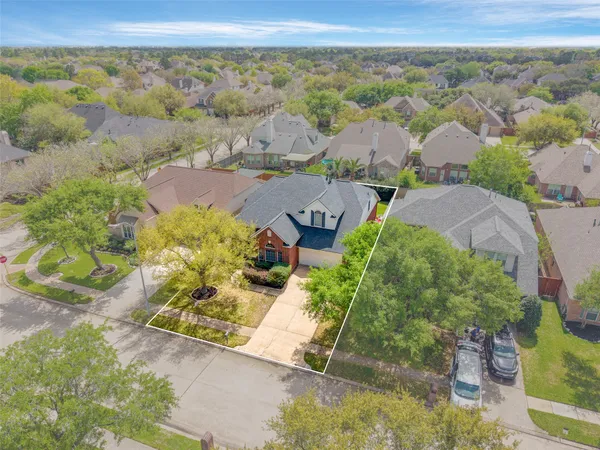 an aerial view of residential house with outdoor space