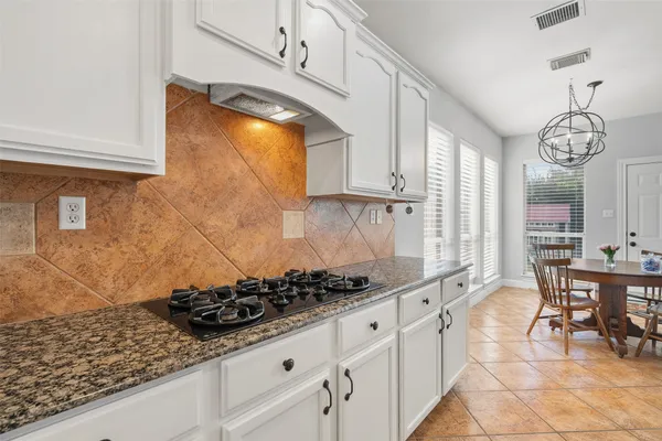 a view of a dining room with furniture and window