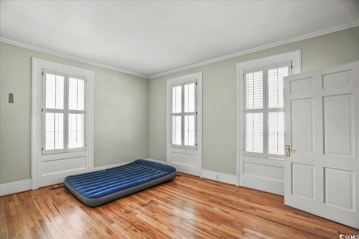 818 Evans Road Marion, SC 29571 - Photo 17 of 39 Foyer entrance with ornamental molding and light wood-style flooring