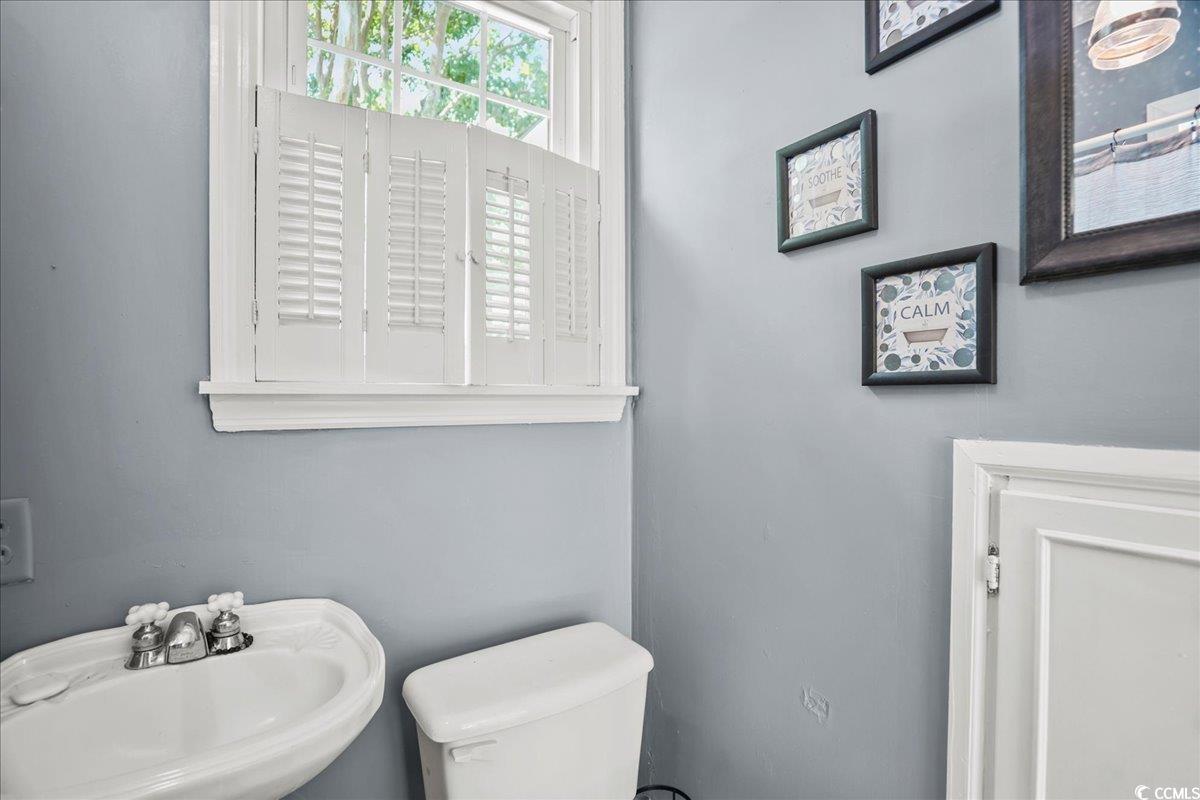 818 Evans Road Marion, SC 29571 - Photo 24 of 39 Half bathroom featuring a sink and toilet