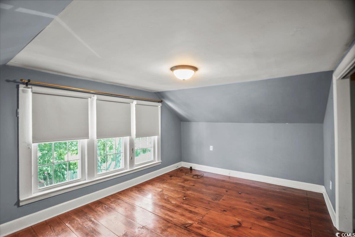 818 Evans Road Marion, SC 29571 - Photo 26 of 39 Additional living space with dark wood-style floors and lofted ceiling