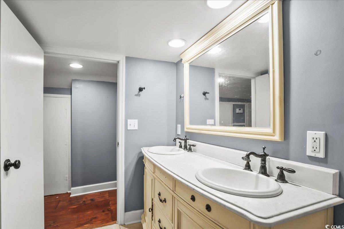 818 Evans Road Marion, SC 29571 - Photo 27 of 39 Bathroom featuring double vanity and dark wood finished floors