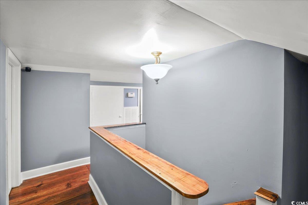 818 Evans Road Marion, SC 29571 - Photo 30 of 39 Hall featuring an upstairs landing and dark wood finished floors