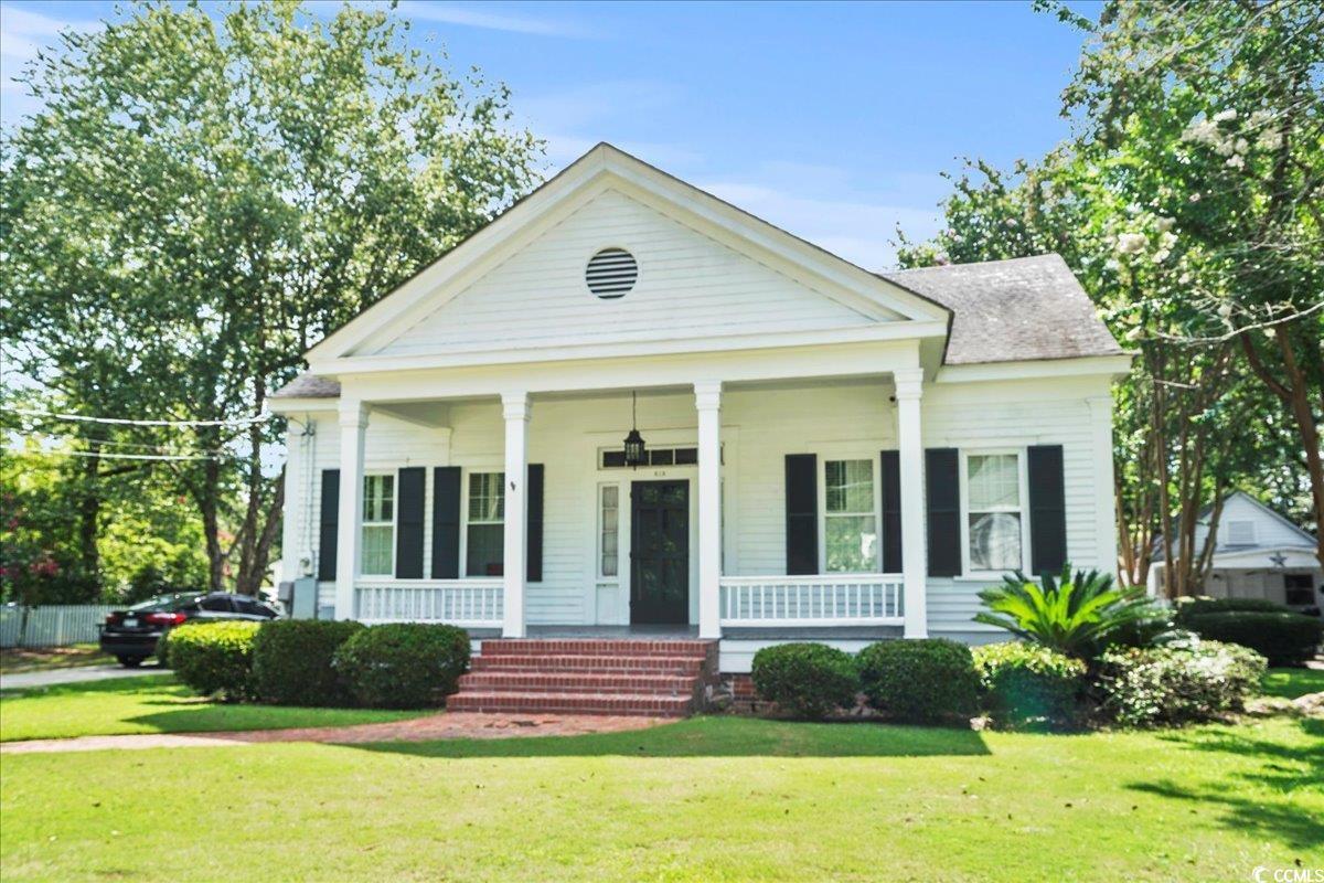 818 Evans Road Marion, SC 29571 - Photo 3 of 39 Neoclassical home featuring covered porch and a front yard
