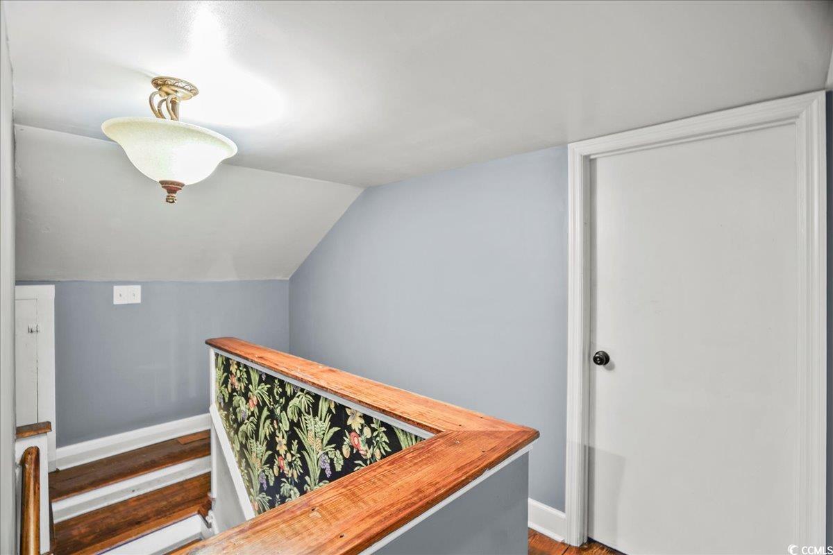 818 Evans Road Marion, SC 29571 - Photo 31 of 39 Staircase featuring wood finished floors and lofted ceiling