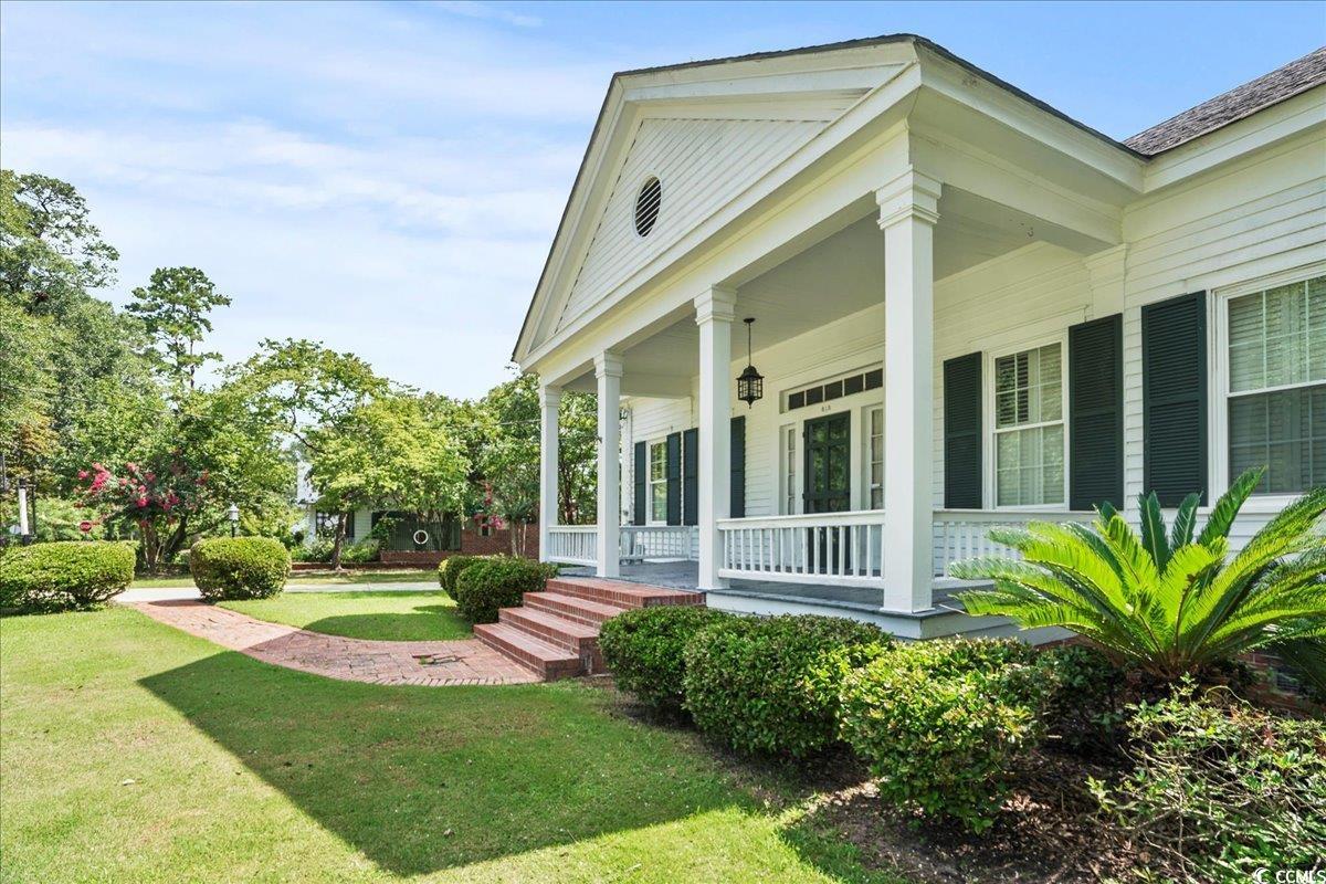 818 Evans Road Marion, SC 29571 - Photo 5 of 39 View of grassy yard with a porch