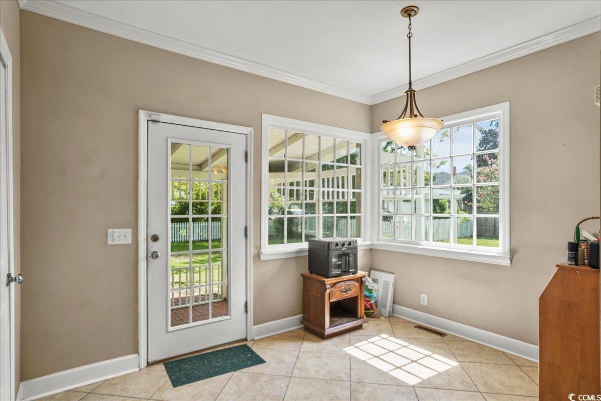 818 Evans Road Marion, SC 29571 - Photo 10 of 39 Doorway with ornamental molding and tile patterned floors