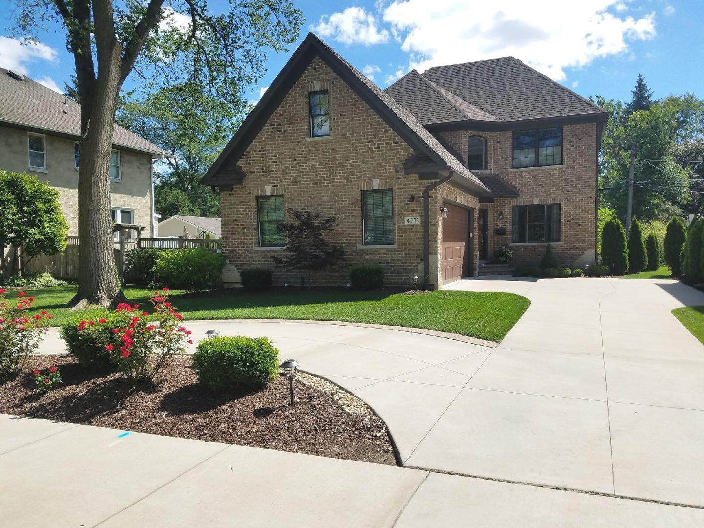 4553 Wolf Road Western Springs, IL 60558 - Photo 1 of 35 a front view of a house with a yard and potted plants