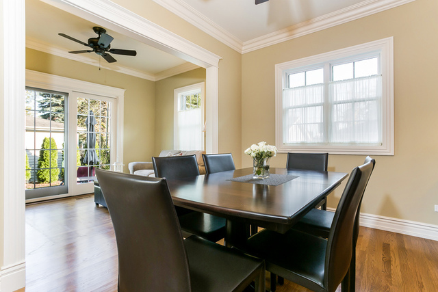 4553 Wolf Road Western Springs, IL 60558 - Photo 12 of 35 a view of a dining room with furniture window and wooden floor