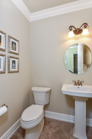 4553 Wolf Road Western Springs, IL 60558 - Photo 14 of 35 a bathroom with a toilet sink and mirror