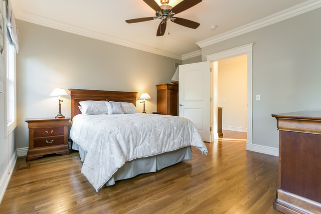 4553 Wolf Road Western Springs, IL 60558 - Photo 15 of 35 a bedroom with a bed and wooden floor