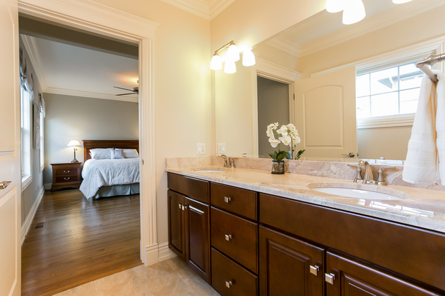 4553 Wolf Road Western Springs, IL 60558 - Photo 17 of 35 a en suite bathroom with double vanity and a mirror