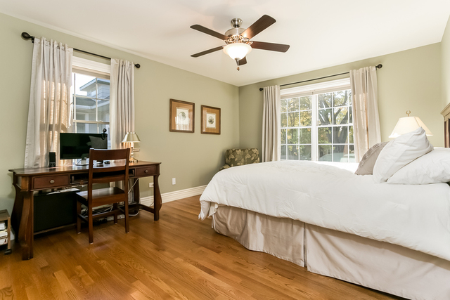 4553 Wolf Road Western Springs, IL 60558 - Photo 20 of 35 a bed sitting in a bedroom next to a window