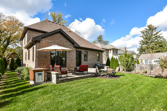 4553 Wolf Road Western Springs, IL 60558 - Photo 3 of 35 a view of a house with backyard porch and sitting area