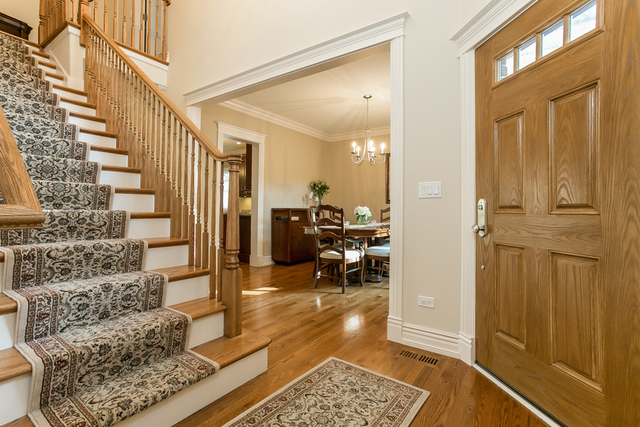 4553 Wolf Road Western Springs, IL 60558 - Photo 4 of 35 a view of a hallway with wooden floor and windows