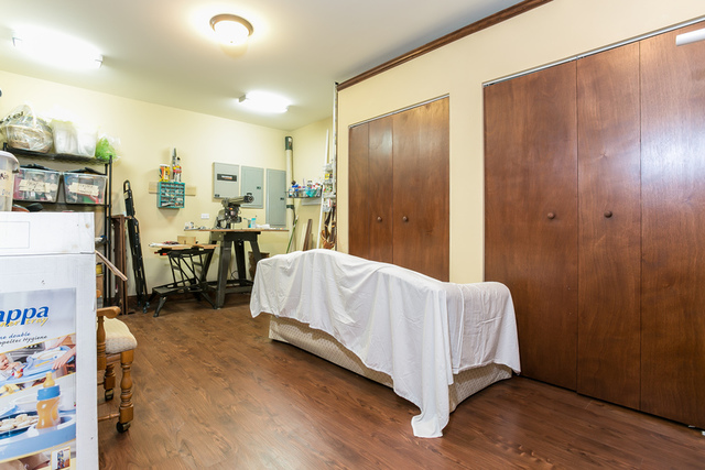 4553 Wolf Road Western Springs, IL 60558 - Photo 31 of 35 a living room with a bed furniture and a flat tv screen