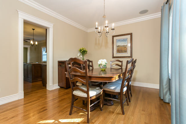 4553 Wolf Road Western Springs, IL 60558 - Photo 5 of 35 a view of a dining room with furniture and wooden floor