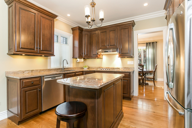 4553 Wolf Road Western Springs, IL 60558 - Photo 7 of 35 a kitchen with granite countertop a sink stove and refrigerator
