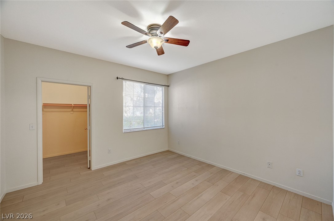 9050 West Warm Springs Road, Unit 1147 Las Vegas, NV 89148 - Photo 22 of 36 A well-lit room featuring durable flooring and a convenient walk-in closet.