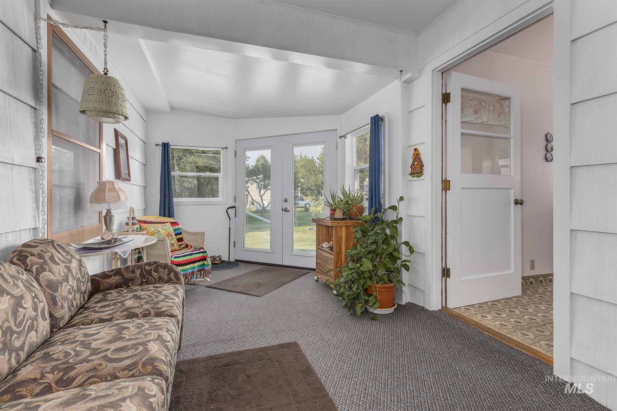 116 Pioneer Road Weiser, ID 83672 - Photo 11 of 41 Living area featuring french doors and carpet flooring