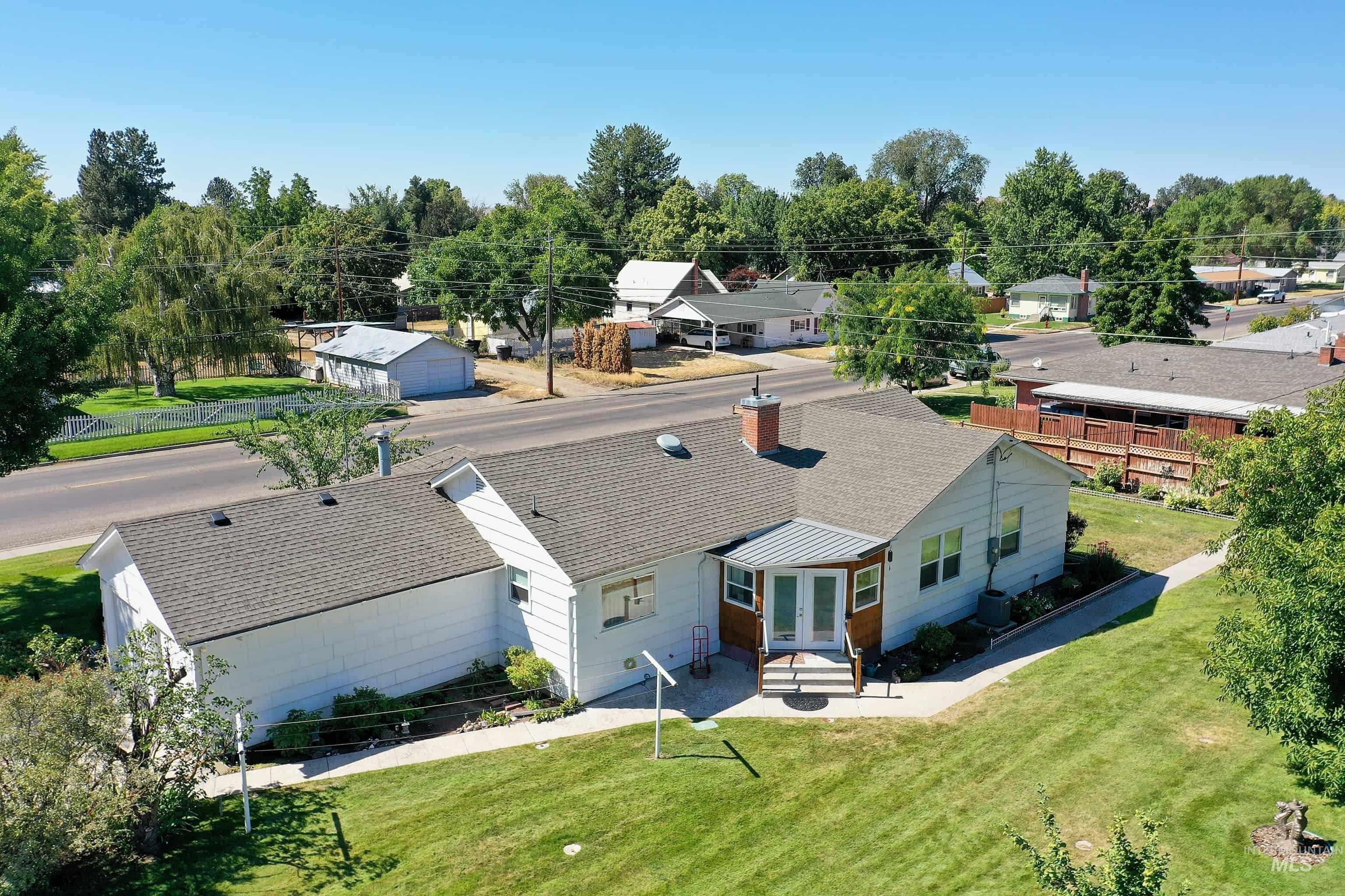 116 Pioneer Road Weiser, ID 83672 - Photo 26 of 41 Aerial perspective of suburban area featuring a tree filled landscape