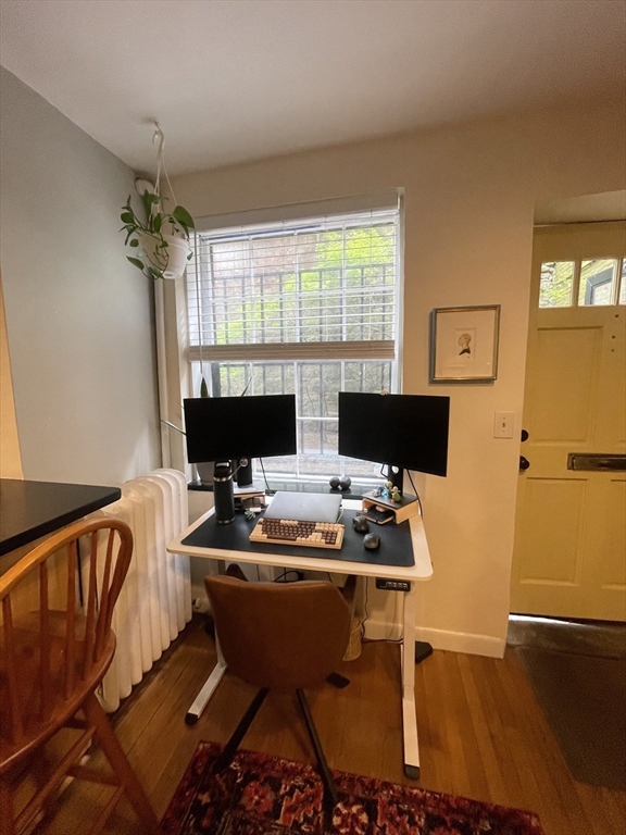 9 Primus Avenue, Unit 1 Boston, MA 02114 - Photo 6 of 19 a view of a workspace with furniture
