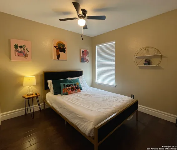 a bedroom that has a bed and a table in it