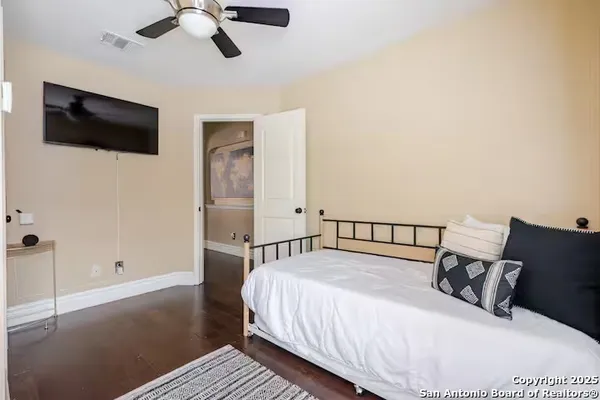 a bed room with a bed and a television