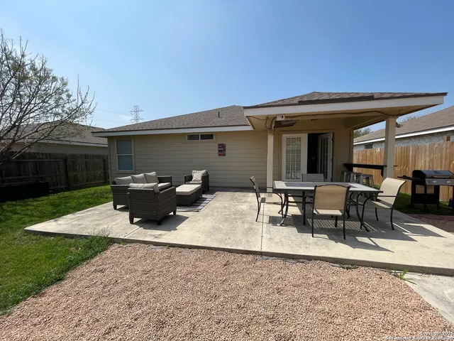 a view of a house with yard porch and sitting area