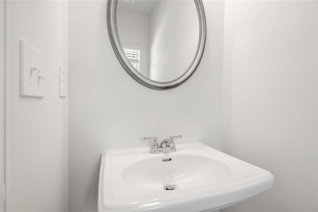 169 Andros Loop Dalton, GA 30721 - Photo 15 of 38 a bathroom with a sink and a mirror