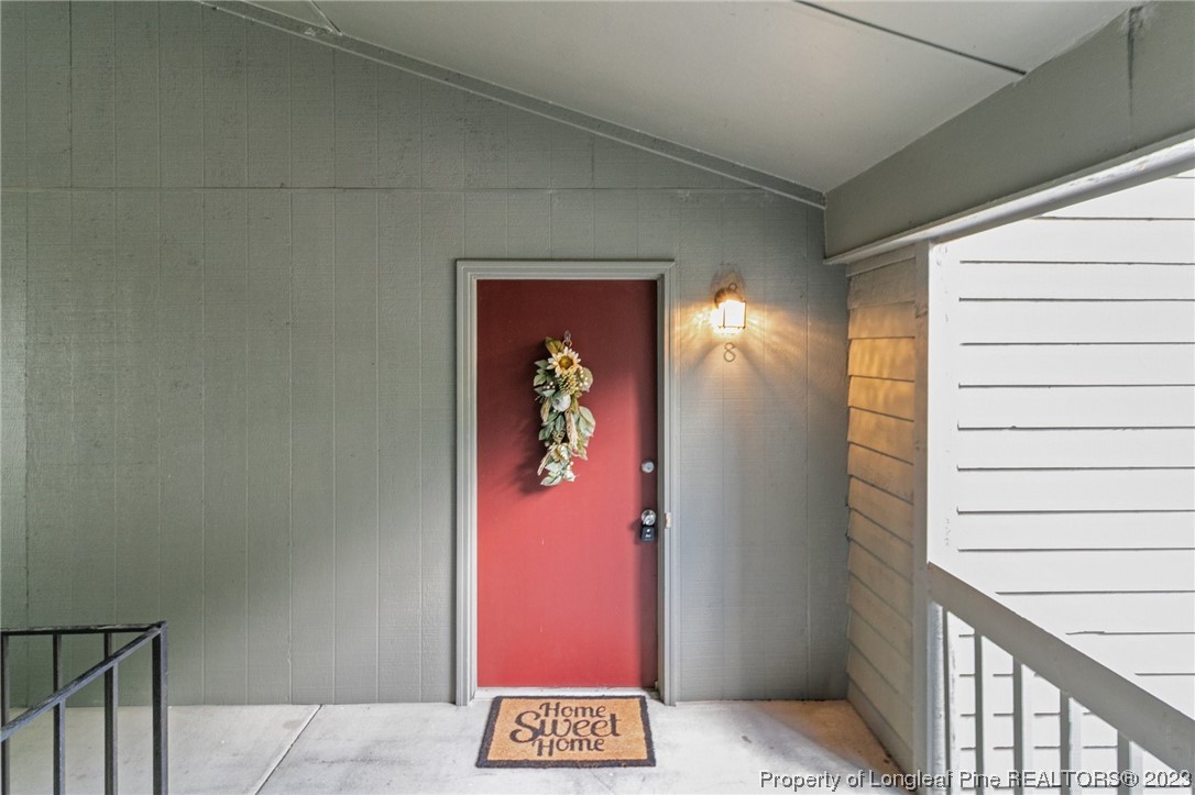 1899 Tryon Drive, Unit 8 Fayetteville, NC 28303 - Photo 1 of 25 a view of a hallway with wooden floor