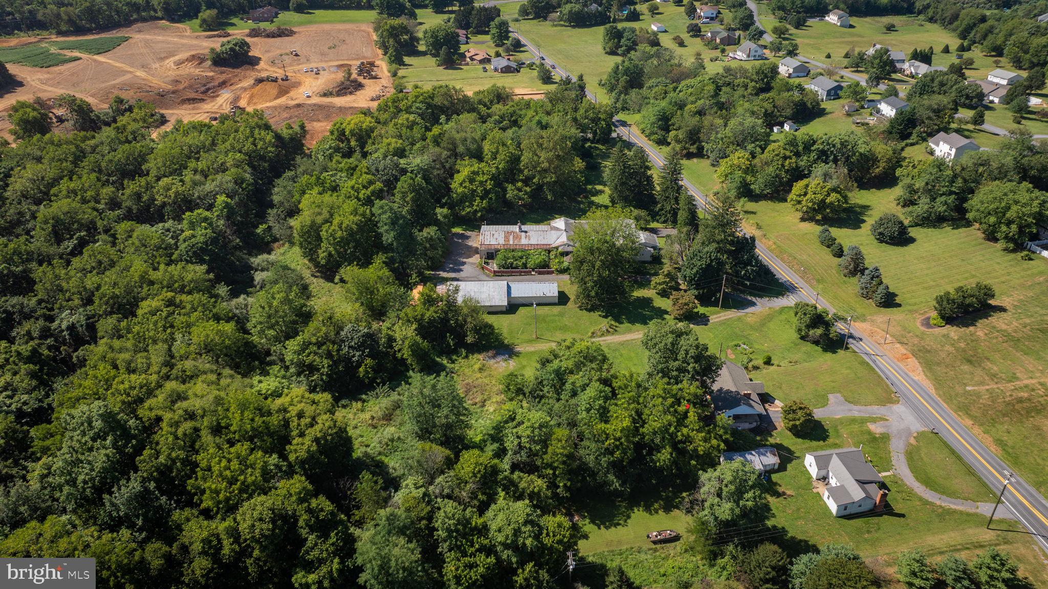 2148 Delmar Orchard Road Martinsburg, WV 25403 - Photo 7 of 22 an aerial view of residential house with outdoor space and trees all around