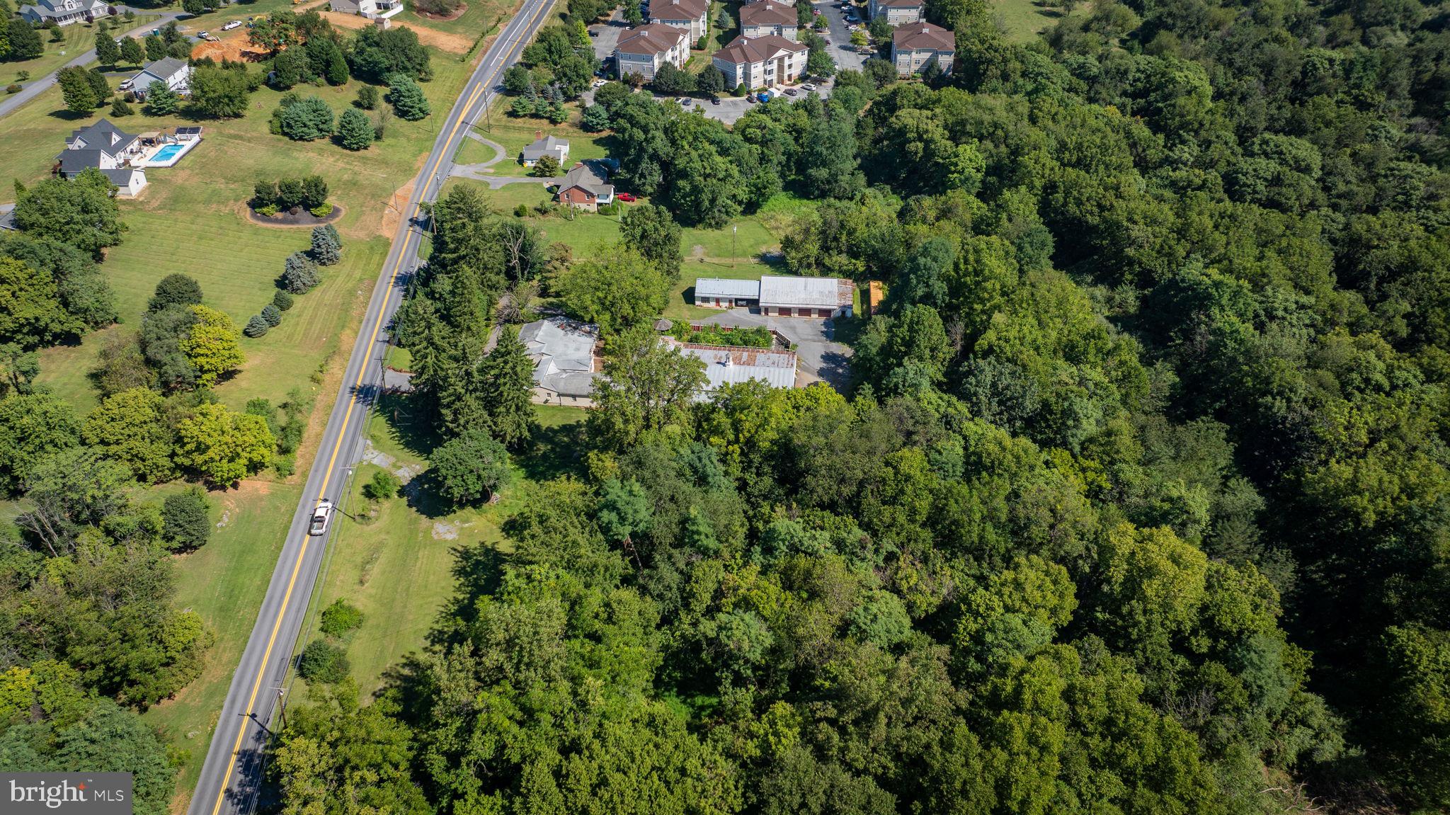 2148 Delmar Orchard Road Martinsburg, WV 25403 - Photo 9 of 22 an aerial view of residential house with outdoor space and trees all around