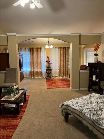 a bedroom with bed and window