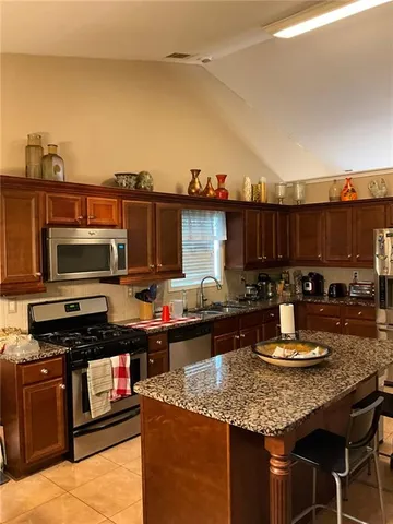 a kitchen with a stove and a microwave