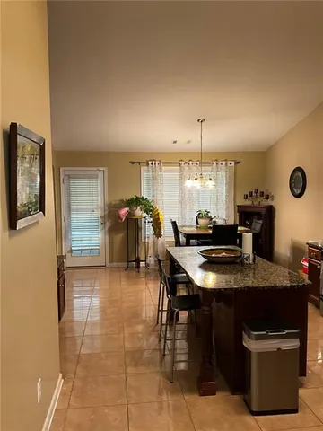 an empty room with wooden floor and furniture