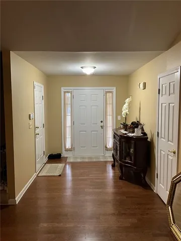 a bed room with furniture and a gym machine