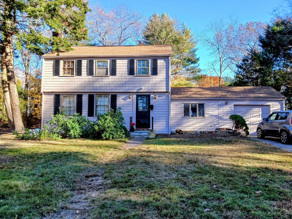 50 Colonial Road Hingham, MA 02043 - Photo 2 of 24 a view of a yard in front of a house
