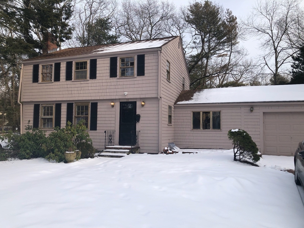 50 Colonial Road Hingham, MA 02043 - Photo 24 of 24 a front view of a house with yard and parking
