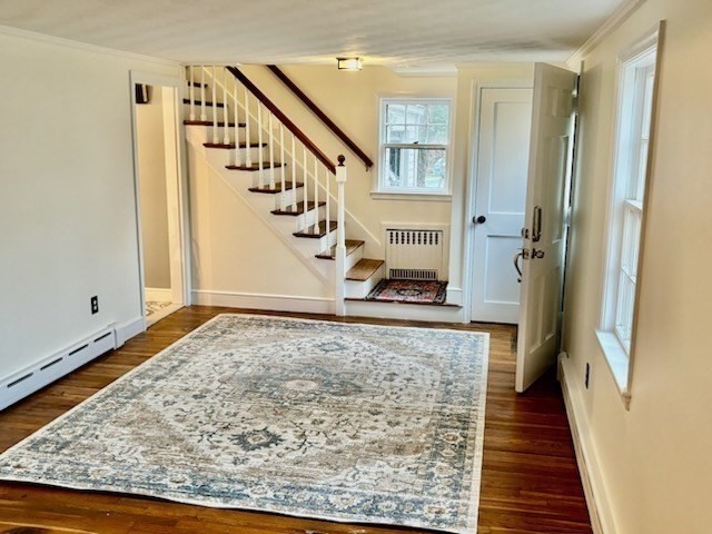 50 Colonial Road Hingham, MA 02043 - Photo 4 of 24 a view of a hallway with wooden floor and staircase
